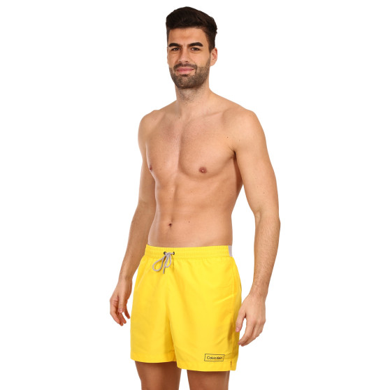 Pánské plavky Calvin Klein žluté (KM0KM00787 ZGR)