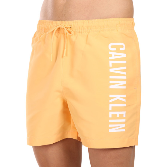 Pánské plavky Calvin Klein oranžové (KM0KM01004-SAN)